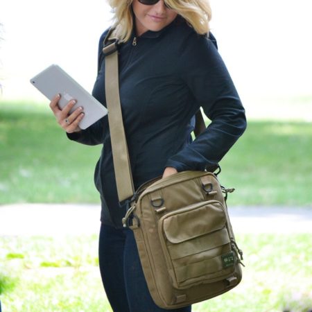 View of a woman using the Khaki Type S-4 Tablet Courier by Skooba Design.