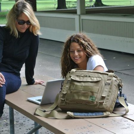 view of the Khaki Type S-4 Laptop Brief by Skooba Design on a picnic table.