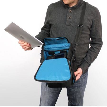 View of a man using the V.3 Photo/Tablet Traveler by Skooba Design.